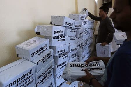 Employees of Snapdeal, an Indian online retailer, sort out delivery packages inside their company fulfilment centre in Mumbai in this October 22, 2014 file photo. REUTERS/Shailesh Andrade/Files