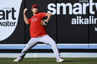 Los Angeles Angels' Shohei Ohtani warms up in the outfield prior to a preseason baseball game against the Los Angeles Dodgers Sunday, March 26, 2023, in Los Angeles. (AP Photo/Mark J. Terrill)