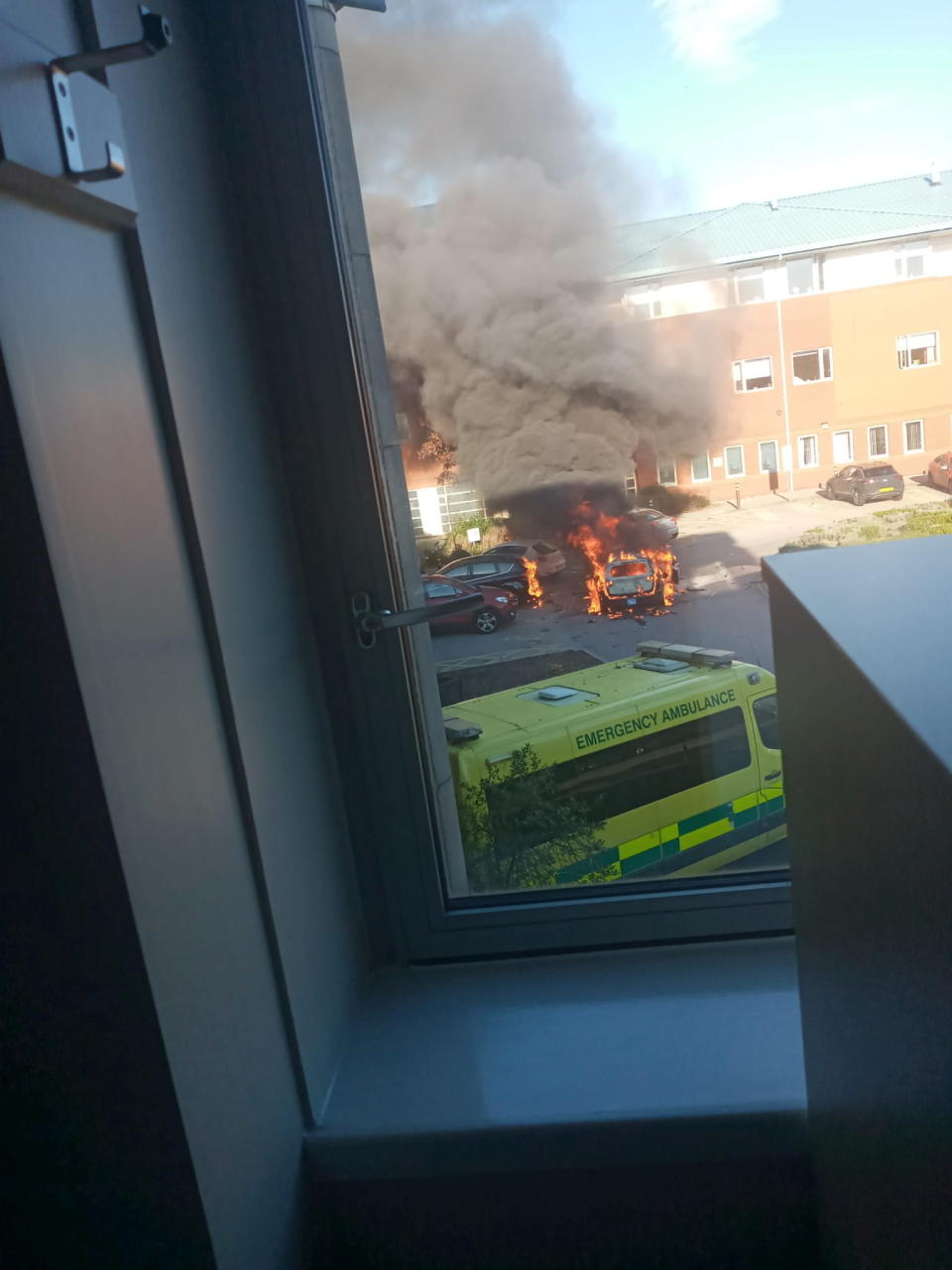 A car burns outside Liverpool Women's hospital in Liverpool, Britain November 14, 2021. Picture taken November 14, 2021. Courtesy of Carl Bessant/via REUTERS  ATTENTION EDITORS - THIS IMAGE HAS BEEN SUPPLIED BY A THIRD PARTY. MANDATORY CREDIT.