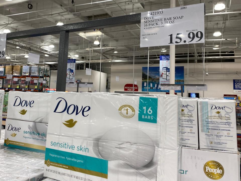 Dove bar soap in packaging with a picture of a white bar of soap with a dove design on it