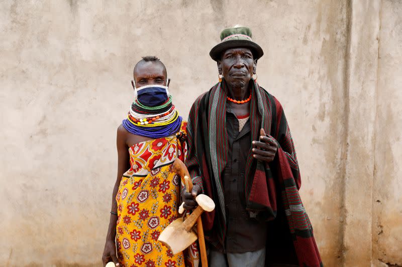 Wear Esinyen, 72, and his wife Namosi Esinyen, 50, from the Turkana tribe pose for a picture in the village of Lorengippi near the town of Lodwar, Turkana county