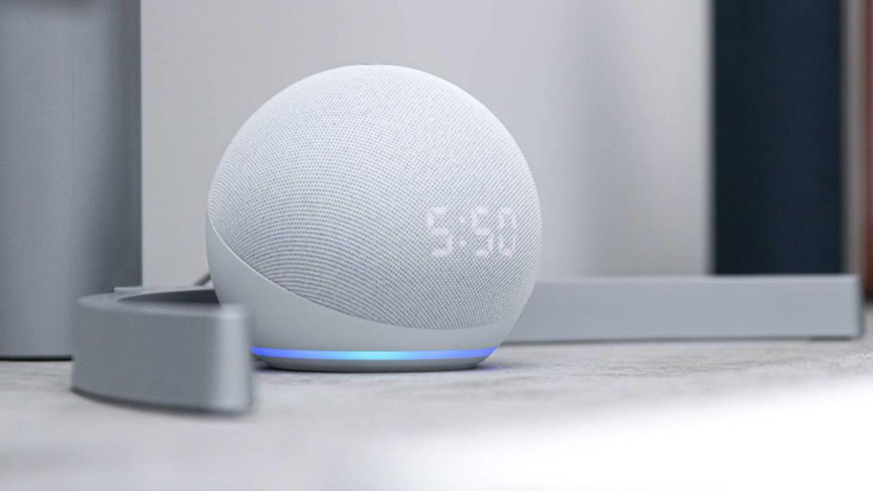  Why I'm switching from Google Assistant to Alexa, a white Echo Dot product sitting on a shelf while displaying the time 