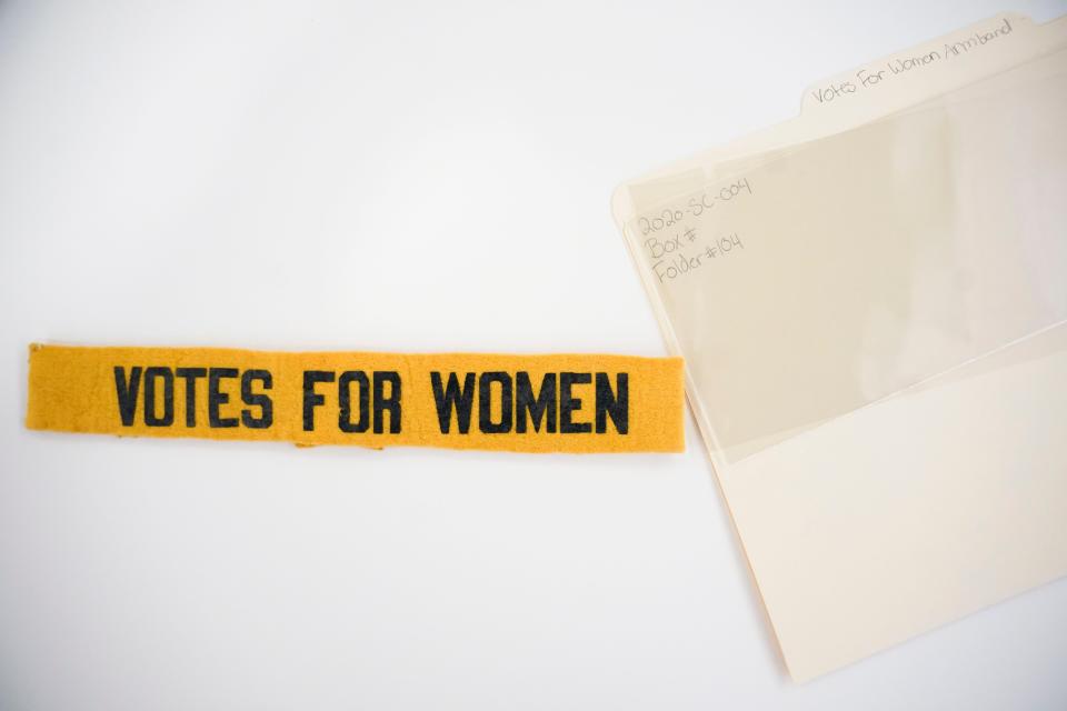 A "Votes for Women" armband and its storage material is shown at Florida Gulf Coast University's library in Fort Myers on Wednesday, Feb. 22, 2023.