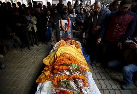 ATTENTION EDITORS - VISUAL COVERAGE OF SCENES OF INJURY OR DEATHPeople gather around the body of former Prime Minister Sushil Koirala in Kathmandu, Nepal, February 9, 2016. REUTERS/Navesh Chitrakar