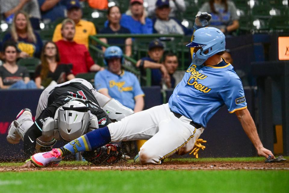 Arizona Diamondbacks catcher Jose Herrera (11) tags out Milwaukee Brewers shortstop Willy Adames (27) trying to score in the seventh inning at American Family Field on Sunday, Sept. 22, 2024.