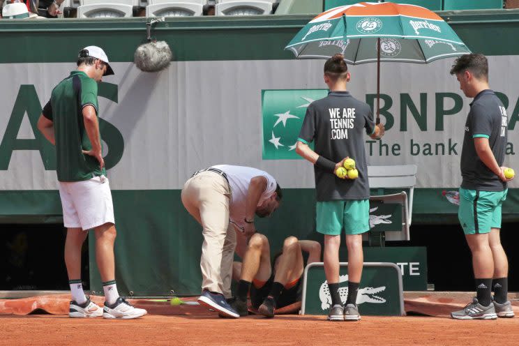 David Goffin was forced to retire after injuring his right ankle. (AP)