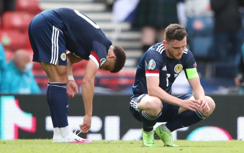 Andrew Robertson (right) shows his disappointment after Scotland's defeat to the Czech Republic - GETTY IMAGES