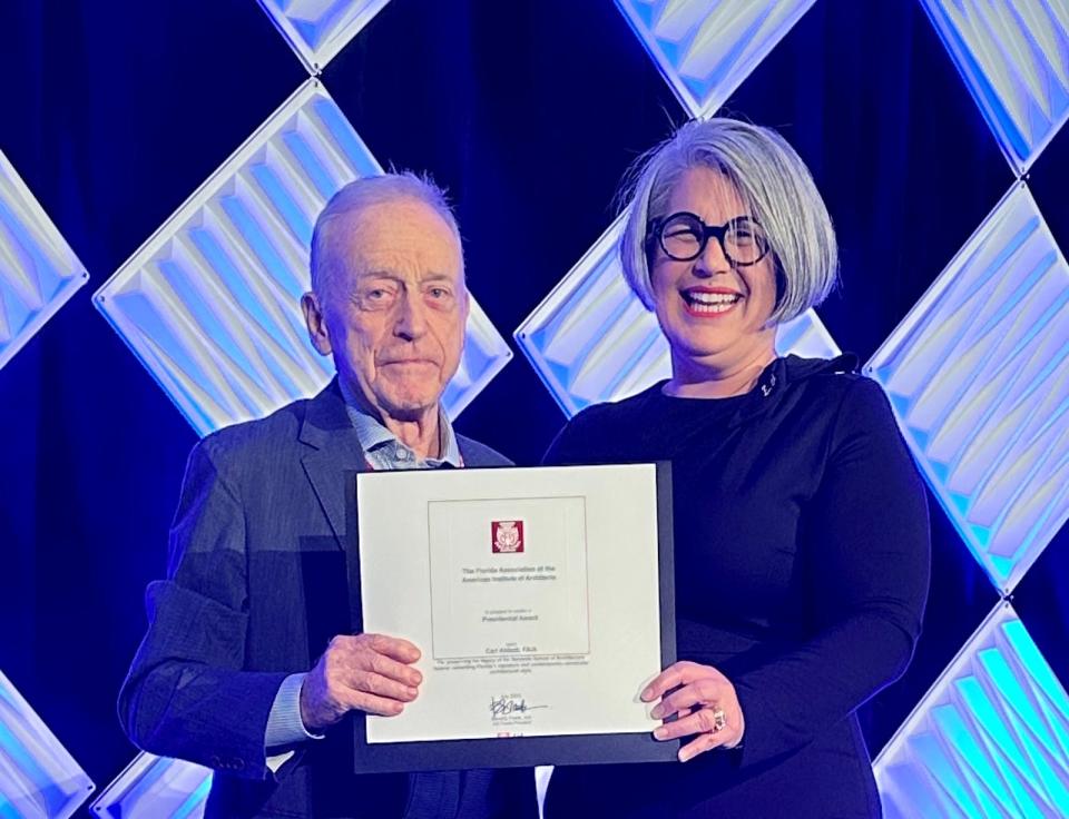 Sarasota architect Carl Abbott receives the Presidential Award from AIA Florida president Beverly Frank at the 2023 AIA Florida Convention.
