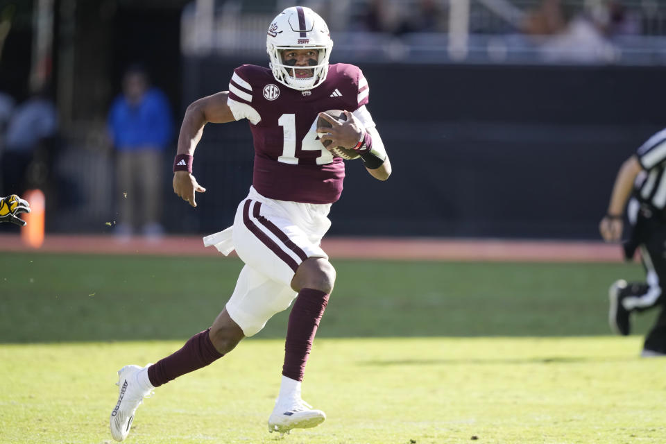 Mississippi State quarterback Mike Wright (14) runs for short yardage against Southern Mississippi during the second half of an NCAA college football game in Starkville, Miss., Saturday, Nov. 18, 2023. (AP Photo/Rogelio V. Solis)