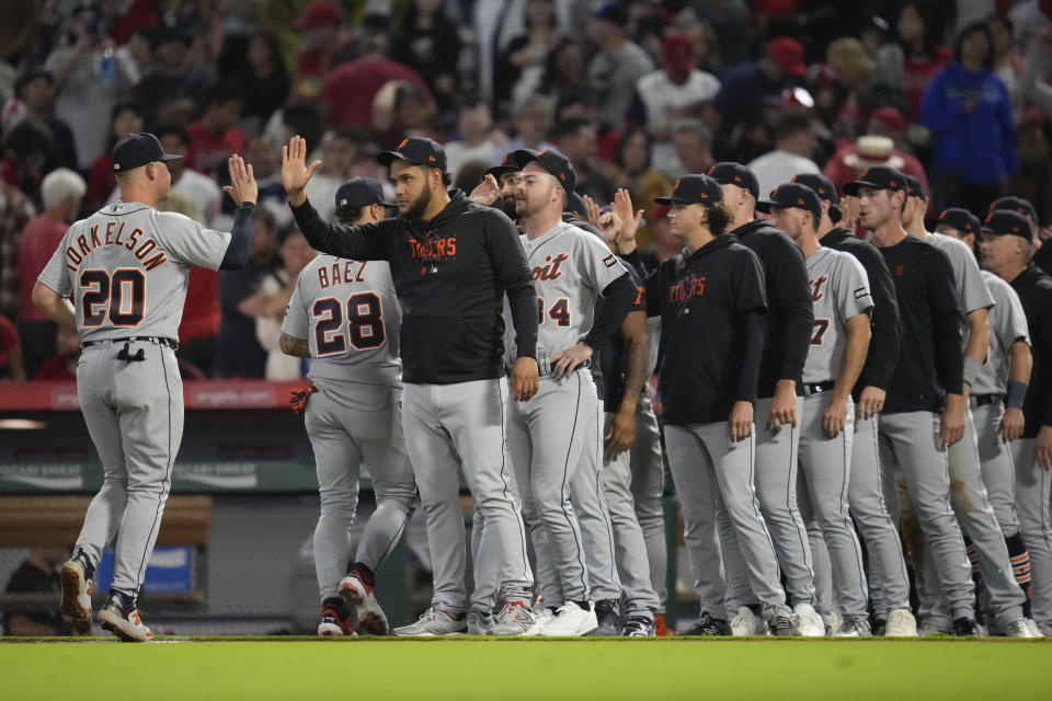 The Detroit Tigers celebrate after winning 5-4 over the Los Angeles Angels in a baseball game in Anaheim, Calif., Saturday, Sept. 16, 2023. (AP Photo/Ashley Landis)