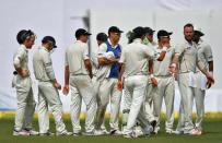 Cricket - India v New Zealand - First Test cricket match - Green Park Stadium, Kanpur - 25/09/2016. New Zealand's players celebrate after taking the wicket of India's Virat Kohli. REUTERS/Danish Siddiqui