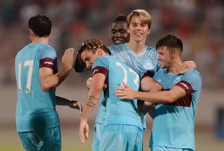 Football - Birkikara v West Ham United - UEFA Europa League Second Qualifying Round Second Leg - Ta' Qali National Stadium, Malta - 23/7/15 West Ham's Diego Poyet celebrates with team mates after scoring the winning penalty in the shootout Mandatory Credit: Action Images / Alan Walter Livepic