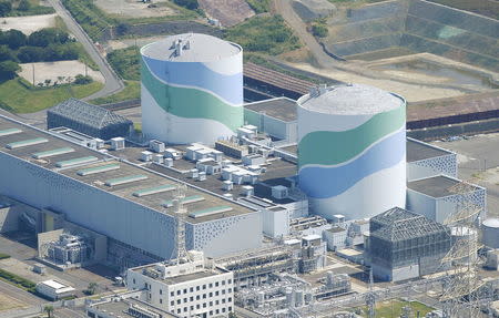 An aerial view shows the No.1 (L) and No.2 reactor buildings at Kyushu Electric Power's Sendai nuclear power station in Satsumasendai, Kagoshima prefecture, Japan, August 11, 2015, in this photo taken by Kyodo. REUTERS/Kyodo