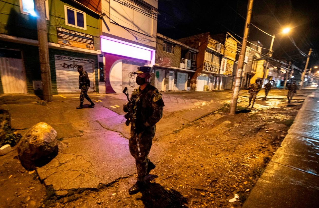 Colombian soldiers patrol the streets in Usme neighborhood, south Bogota, on July 15, 2020: AFP via Getty Images