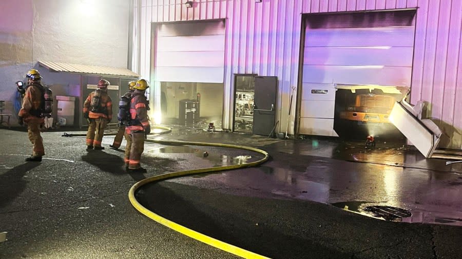 Portland firefighters extinguish inner eastside warehouse blaze leaving charred vehicle in its wake