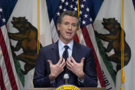 FILE - In this Jan. 8, 2021, file photo, California Gov. Gavin Newsom outlines his 2021-2022 state budget proposal during a news conference in Sacramento, Calif. California Democratic leaders are being criticized after attempting to link the insurrection at the U.S. Capitol with efforts to recall Newsom. State Democratic Party Chair Rusty Hicks led a group of Democratic officials who described the effort to remove Newsom as a “coup” and claimed, without evidence, that those involved were far-right extremists. (AP Photo/Rich Pedroncelli, Pool, File)