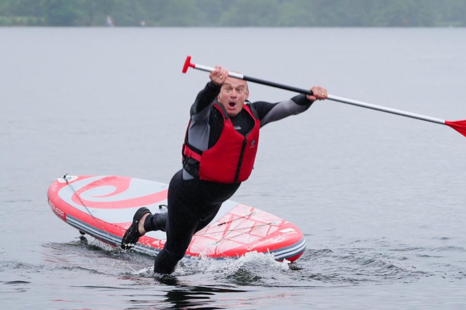 Sir Ed falls into the water while paddleboarding on Lake Windermere, while on the general election campaign trail (PA Wire)