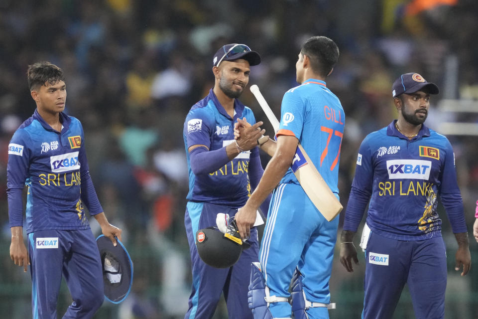 Sri Lanka's captain Dasun Shanaka congratulates Shubman Gill after India won the Asia Cup final cricket match in Colombo, Sri Lanka, Sunday, Sept.17, 2023. (AP Photo/Eranga Jayawardena)