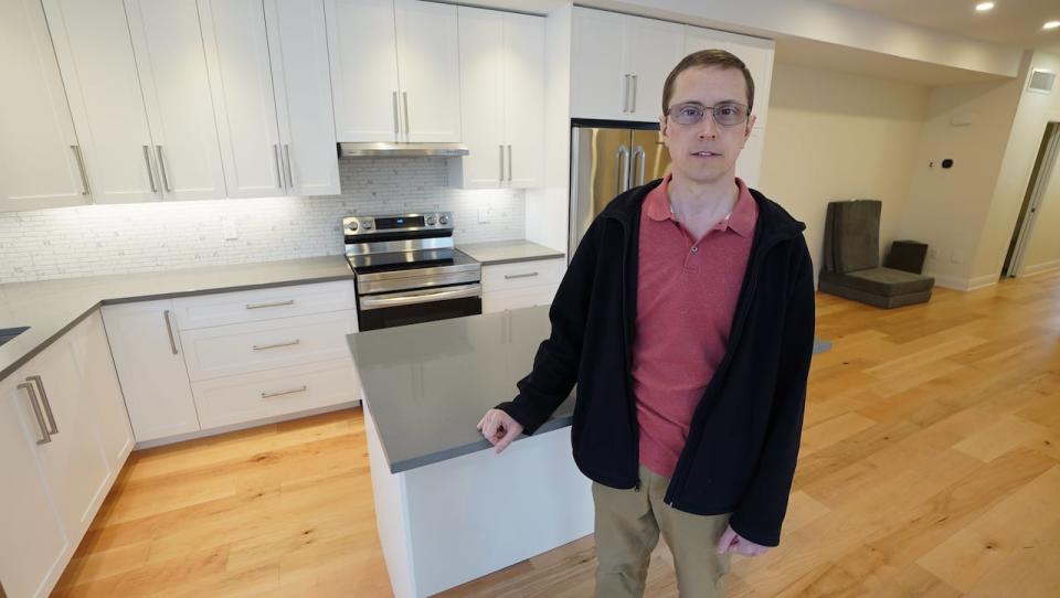 David Pittis stands in the finished home he hopes to sever from his property and rent out. 