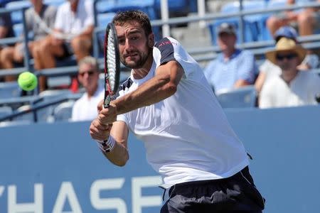 Aug 29, 2016; New York, NY, USA; Marin Cilic of Croatia returns a shot for the win against Roger Dutra Silva of Brazil on day one of the 2016 U.S. Open tennis tournament at USTA Billie Jean King National Tennis Center. Mandatory Credit: Anthony Gruppuso-USA TODAY Sports