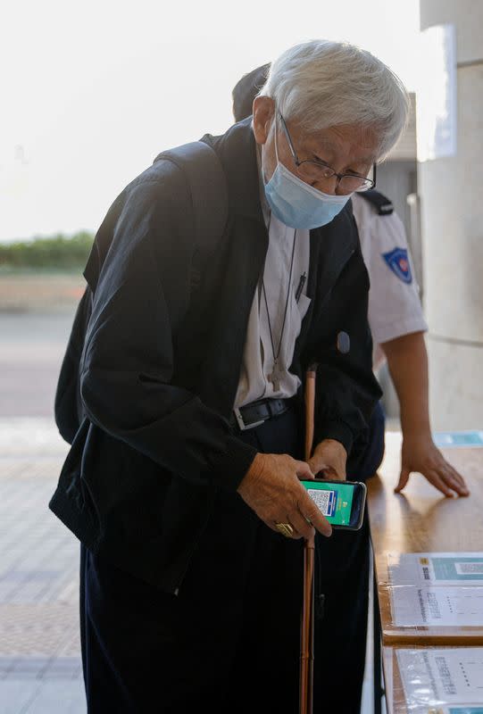 Retired bishop Cardinal Joseph Zen Ze-kiun arrives at the West Kowloon Magistrates' courts for allegedly failing to register the legal and medical fund that helped those embroiled in the 2019 anti-government protests as a society, in Hong Kong