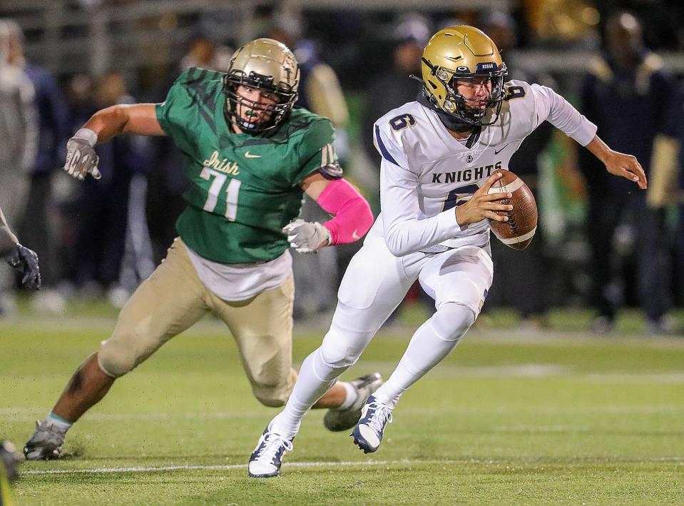 St. Vincent-St. Mary's Bryson Getz chases Hoban quarterback JacQai Long out of the pocket on Friday, Oct. 7, 2022 in Akron at John Cistone Field.