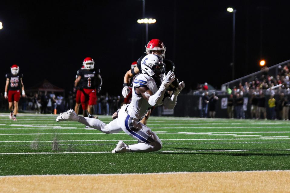 Calvary Day's Thomas Blackshear catches a pass from Jake Merklinger in 2023's win over Savannah Christian at Pooler Stadium.