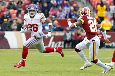 New York Giants running back Saquon Barkley (26) carriers the ball as Washington Redskins strong safety Ha Ha Clinton-Dix (20) chases in the second quarter at FedEx Field - Credit: Geoff Burke/USA TODAY