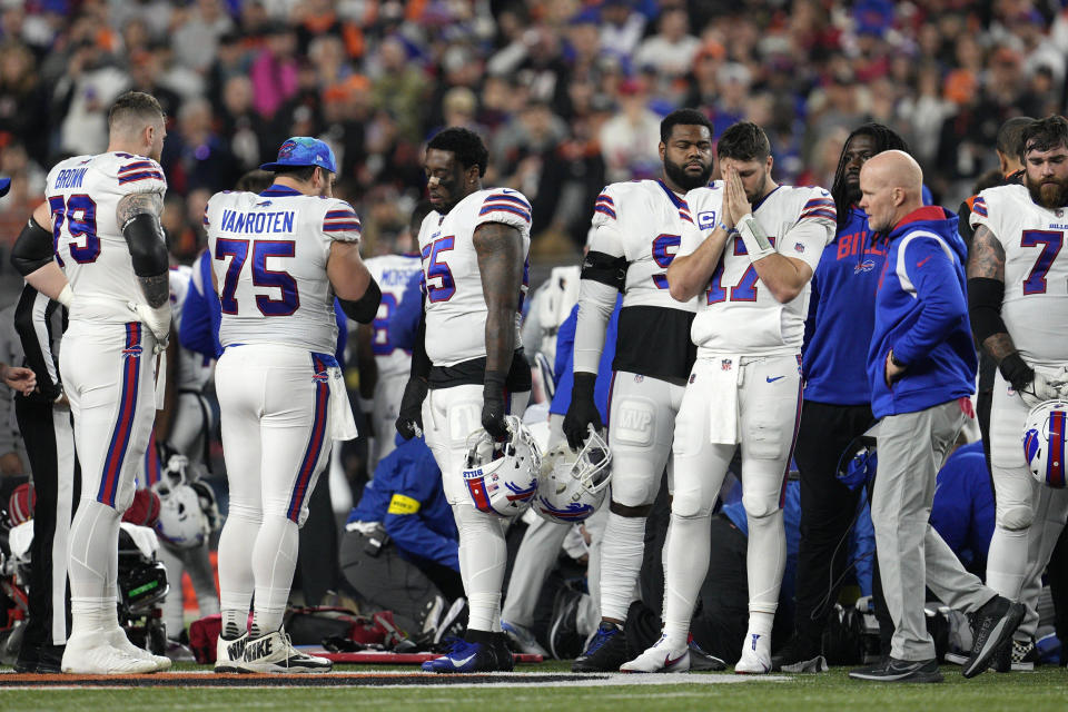 Buffalo Bills quarterback Josh Allen (17) pauses as Damar Hamlin is examined during the first half of an NFL football game against the Cincinnati Bengals, Monday, Jan. 2, 2023, in Cincinnati. (Jeff Dean / AP)