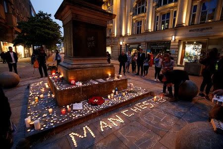 People attend a vigil for the victims of last week's attack at a pop concert at Manchester Arena, in central Manchester, Britain May 29, 2017. REUTERS/Andrew Yates TPX IMAGES OF THE DAY