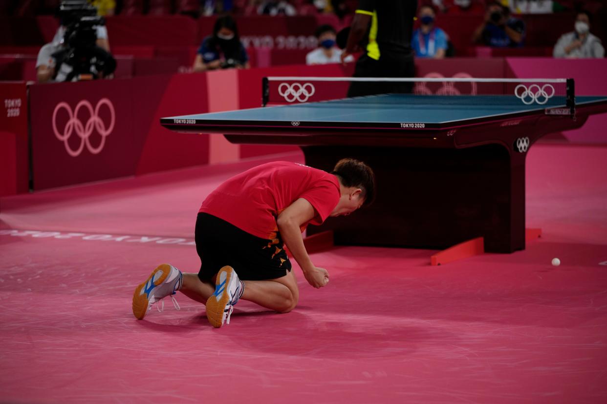 Singapore's Clarence Chew Zhe Yu celebrate after winning table tennis men's singles first-round match against Senegal's Ibrahima Diaw at the 2020 Summer Olympics, Saturday, July 24, 2021, in Tokyo.