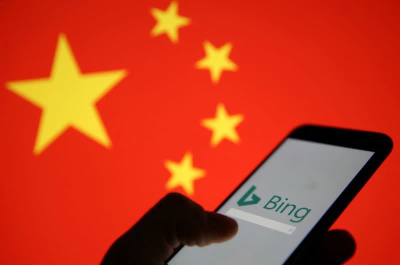 FILE PHOTO: A smartphone with the Microsoft Bing logo is displayed against the backdrop of a Chinese flag in this picture illustration