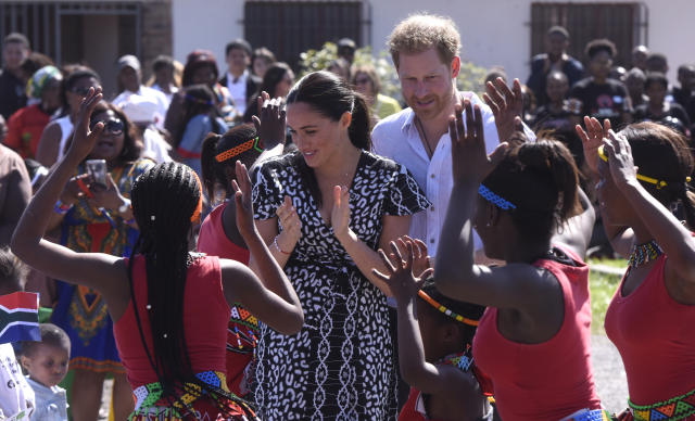 CAPE TOWN, SOUTH AFRICA - SEPTEMBER 23: The Duke and Duchess of Sussex, Prince Harry and his wife Meghan interact with children during The Duke and Duchess of Sussex visit to Nyanga Township on September 23, 2019 in Cape Town, South Africa. Their Royal Highnesses made their first visit in South Africa, to a Justice Desk initiative in Nyanga township, which teaches children about their rights, self-awareness and safety, and provides self-defence classes and female empowerment training to young girls in the community. (Photo by Brenton Geach/Gallo Images via Getty Images)