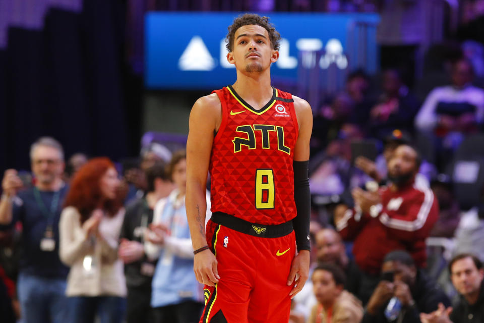 Atlanta Hawks guard Trae Young (11) wears a No. 8 jersey honoring former NBA player Kobe Bryant prior to an NBA basketball game against the Washington Wizards, Sunday, Jan. 26, 2020, in Atlanta. Bryant died in a California helicopter crash Sunday. (AP Photo/Todd Kirkland)