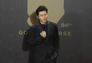 Taiwanese actor Morning Mo arrives at the 58th Golden Horse Awards in Taipei, Taiwan, Saturday, Nov. 27, 2021. Mo is a guest at this year's Golden Horse Awards, one of the Chinese-language film industry's biggest annual events. (AP Photo/ Billy Dai)