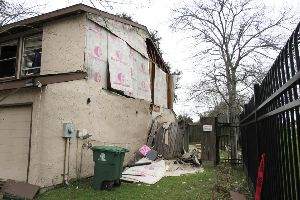 In this Thursday, Jan. 30, 2020, photo, a Houston home remains in disrepair after being damaged by the Jan. 24, 2020, explosion at a nearby industrial business. Last month's explosion at a Houston metal fabricating and manufacturing company that killed two workers and damaged hundreds of structures has renewed debate over the city's lack of zoning. (AP Photo/ Juan Lozano)