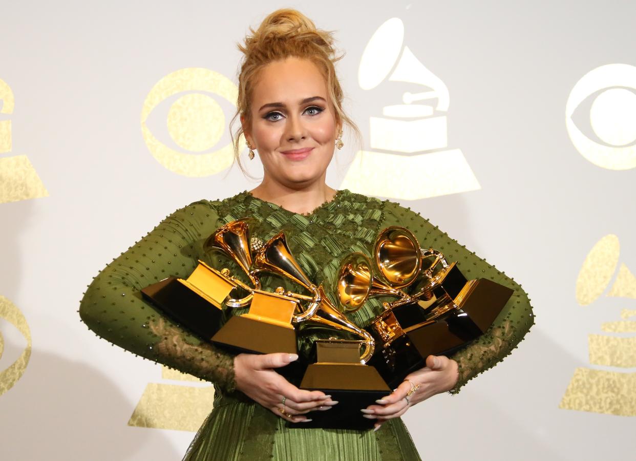 LOS ANGELES, CA - FEBRUARY 12: Singer Adele poses in the press room with her awards for Album Of The Year and Best Pop Vocal Album for "25" and Song Of The Year, Record Of The Year and Best Pop Solo Performance for "Hello" at The 59th GRAMMY Awards at Staples Center on February 12, 2017 in Los Angeles, California. (Photo by Dan MacMedan/WireImage)