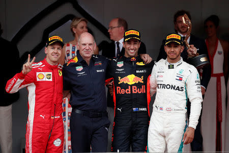 Formula One F1 - Monaco Grand Prix - Circuit de Monaco, Monte Carlo, Monaco - May 27, 2018 Red Bull's Daniel Ricciardo celebrates winning the race with Red Bull chief technical officer Adrian Newey, Ferrari's Sebastian Vettel who finished second and Mercedes' Lewis Hamilton who finished in third while Prince Albert II of Monaco and Charlene, Princess of Monaco look on REUTERS/Benoit Tessier