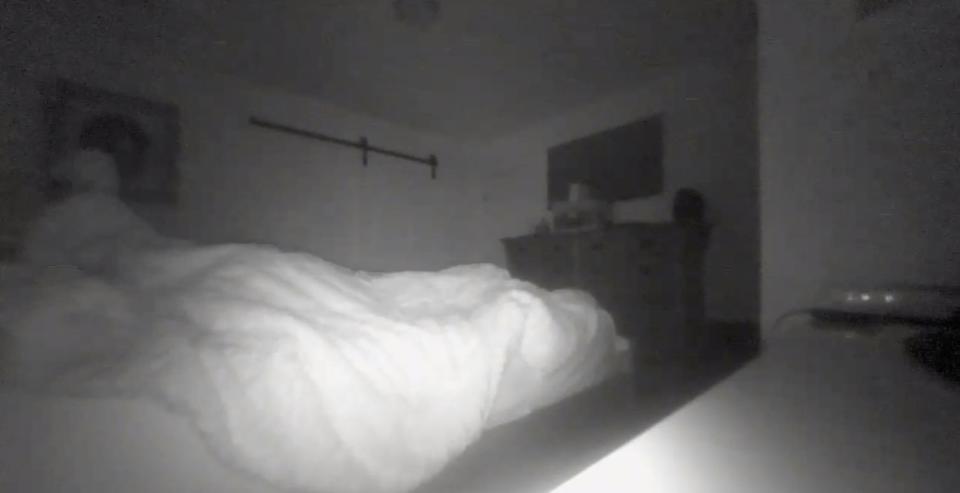 A father complained about someone messing with his sheets at night, and his daughter shared the ghostly footage on social media. (Photo: Reddit)