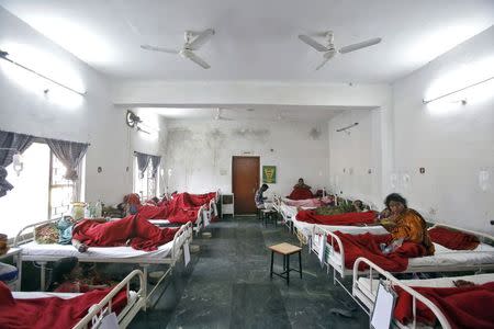 Women, who underwent a sterilization surgery at a government mass sterilisation "camp", lie in hospital beds for treatment at Chhattisgarh Institute of Medical Sciences (CIMS) hospital in Bilaspur, in the eastern Indian state of Chhattisgarh, November 13, 2014. REUTERS/Anindito Mukherjee