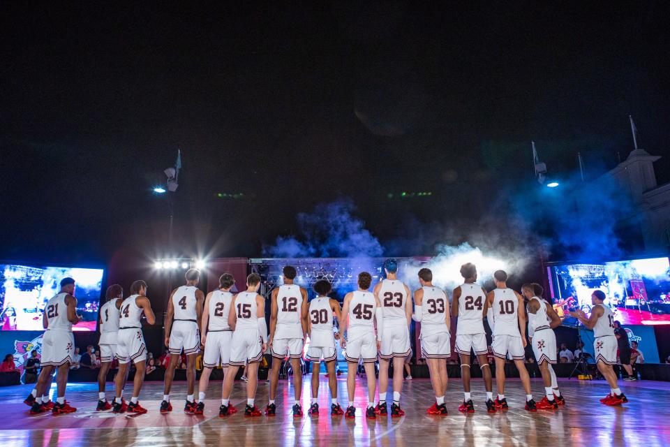 The men's basketball team is introduced during the Louisville Live Hoops event at Churchill Downs on Saturday evening. Sept. 18, 2021