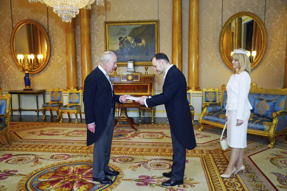 Ambassador of Moldova, Ruslan Bolbocean presents his credentials to Britain's King Charles III, left, during a private audience at Buckingham Palace, London, Thursday March 28, 2024. (Victoria Jones/Pool Photo via AP)