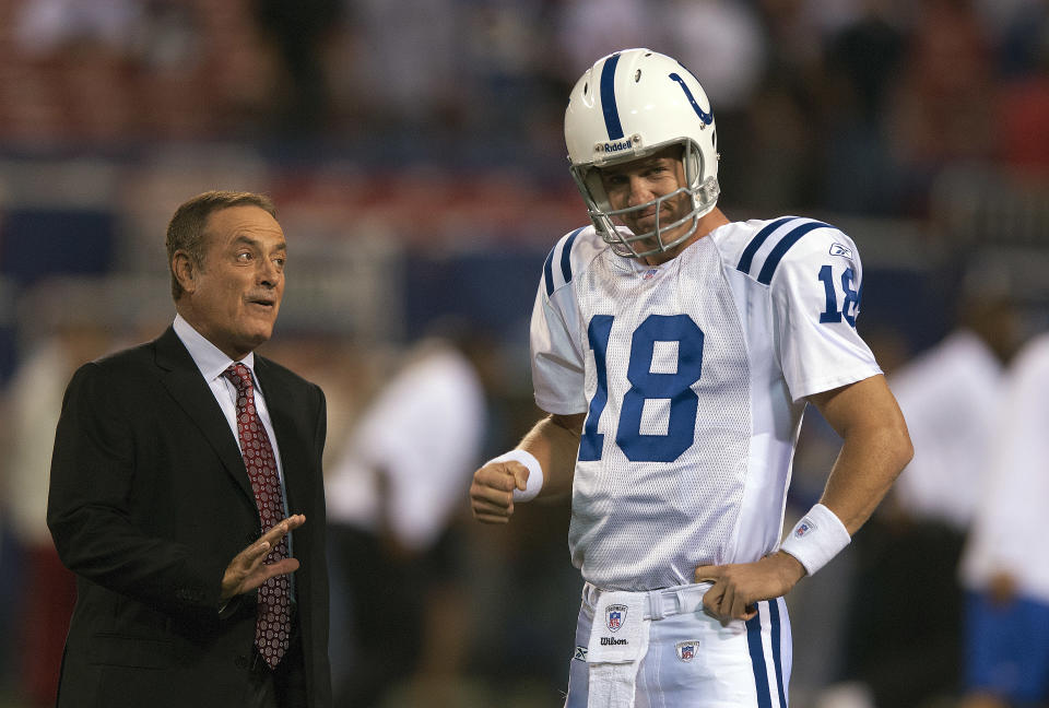 Peyton Manning and  Al Michaels chat before a 2006 game, when Manning was quarterback of the Colts. (Photo by Focus on Sport/Getty Images)