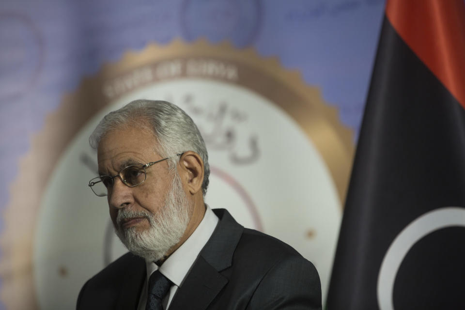 Libyan Foreign Minister Mohamed Siala gives a press conference after an attack on the ministry of foreign affairs building, in Tripoli, Libya, Tuesday, Dec, 25, 2018. Security officials said Tuesday that a suicide bomber targeted Libya's Foreign Ministry in Tripoli, killing several people. The officials said a second attacker was shot dead by guards before he could detonate his explosive vest. No one immediately claimed the attack, which bore the hallmarks of the Islamic State group. (AP Photo/Mohamed Ben Khalifa)