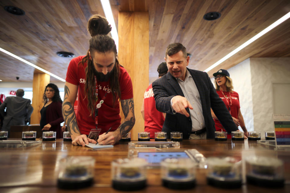 <p>Eron Silverstein, 51, (R) shops for marijuana at the MedMen store in West Hollywood, Calif., Jan. 2, 2018. (Photo: Lucy Nicholson/Reuters) </p>