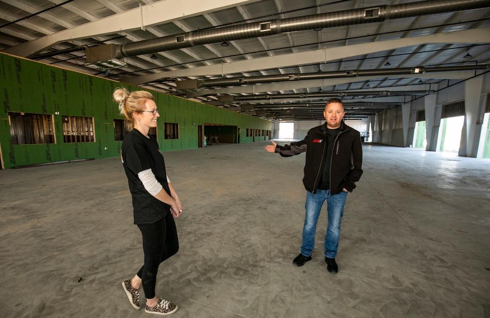 Brittany Hart and her husband Josh Hart talk about the expansion of their business, Burnyzz Speed Shop, while standing in the new showroom building that will house over 80 cars in the 55,000 sq. ft. building, Friday afternoon, December 17, 2020.