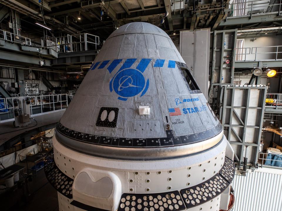 boeing starliner spaceship grey gumdrop capsule with blue markings