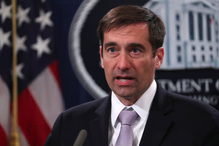 FILE PHOTO: Assistant U.S. Attorney General for National Security John Demers addresses a news conference to announce a criminal law enforcement action involving China and a new Department of Justice initiative focusing on China’s economic activity, at the Justice Department in Washington, U.S. November 1, 2018. REUTERS/Jonathan Ernst