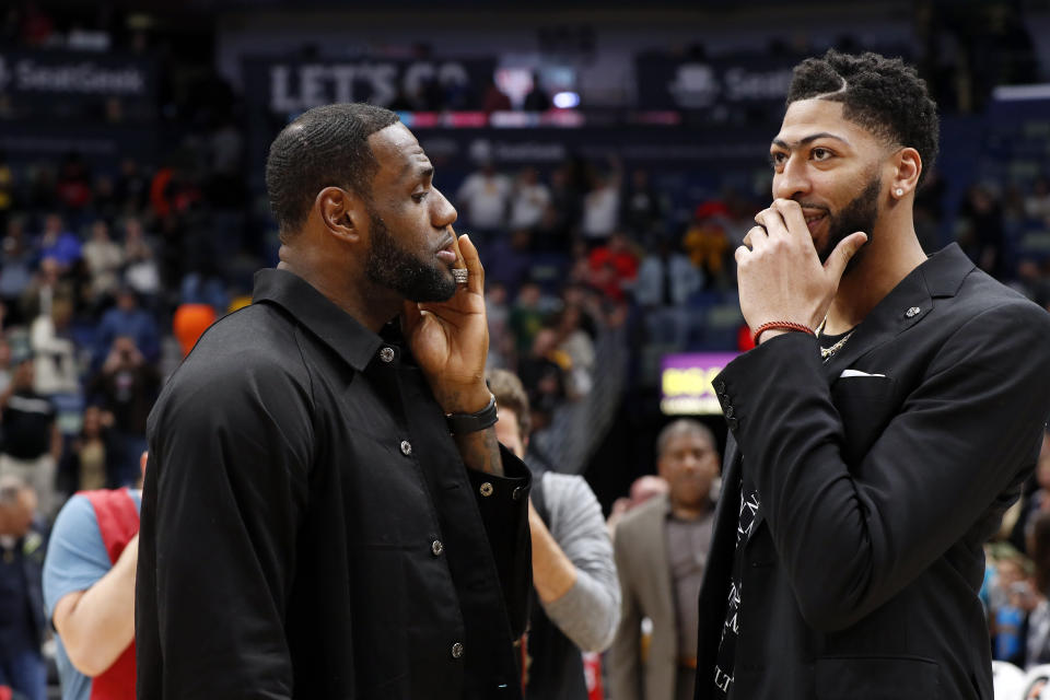 Los Angeles Lakers forward LeBron James (23) and New Orleans Pelicans forward Anthony Davis (23) after an NBA basketball game in New Orleans, Sunday, March 31, 2019. The Lakers won 130-102. (AP Photo/Tyler Kaufman)