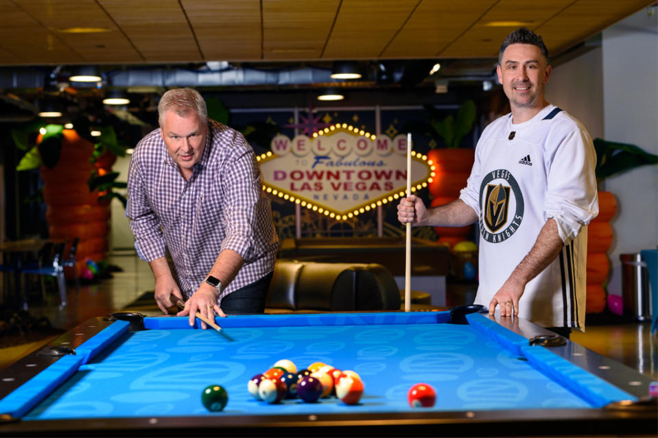 Zappos execs Jeff Espersen (L) and Scott Schaefer hit the billiard table in the company’s lobby. - Credit: Patrick Gray